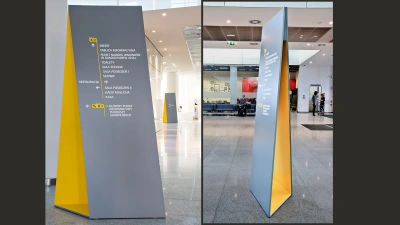 Projekt wayfindingu (drogowskaz&oacute;w) w budynku UMWW &ndash; totemy z nawigacją skonstruowane są tak, aby tworzyły złudzenie optyczne